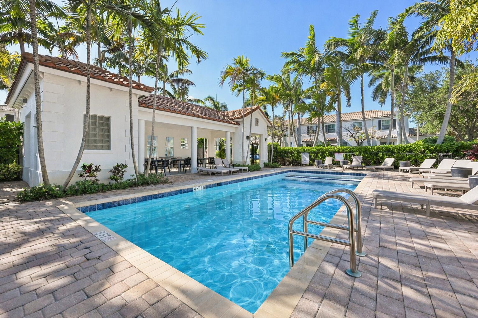 482 Graham Place Boynton Beach, FL 33435 - Photo 32 of 39 a swimming pool with outdoor seating and yard