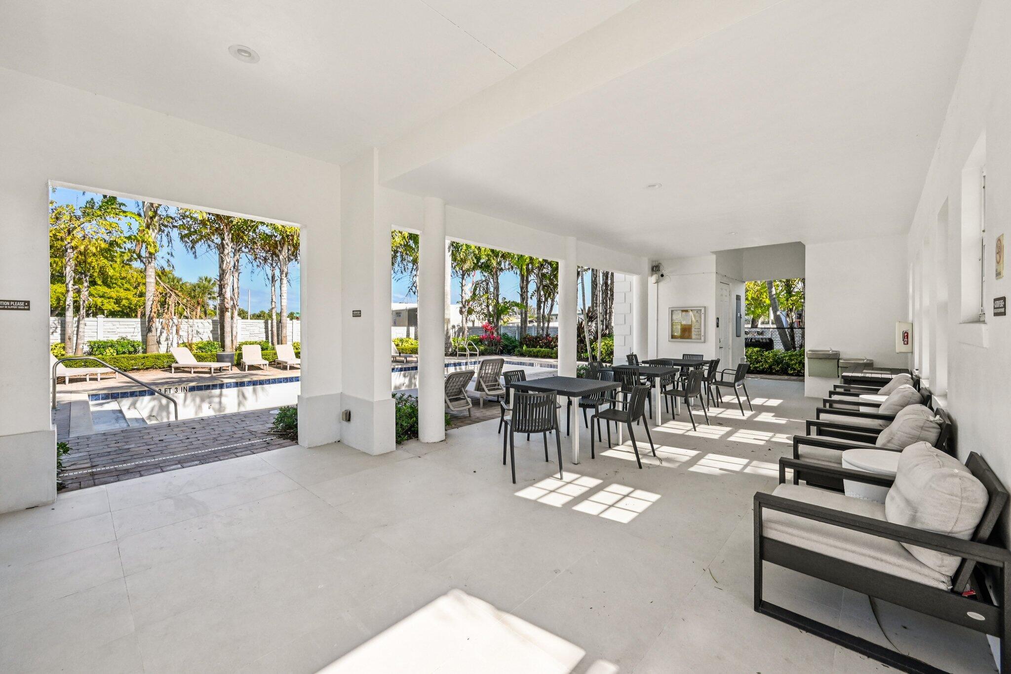 482 Graham Place Boynton Beach, FL 33435 - Photo 37 of 39 a living room with furniture and a large window