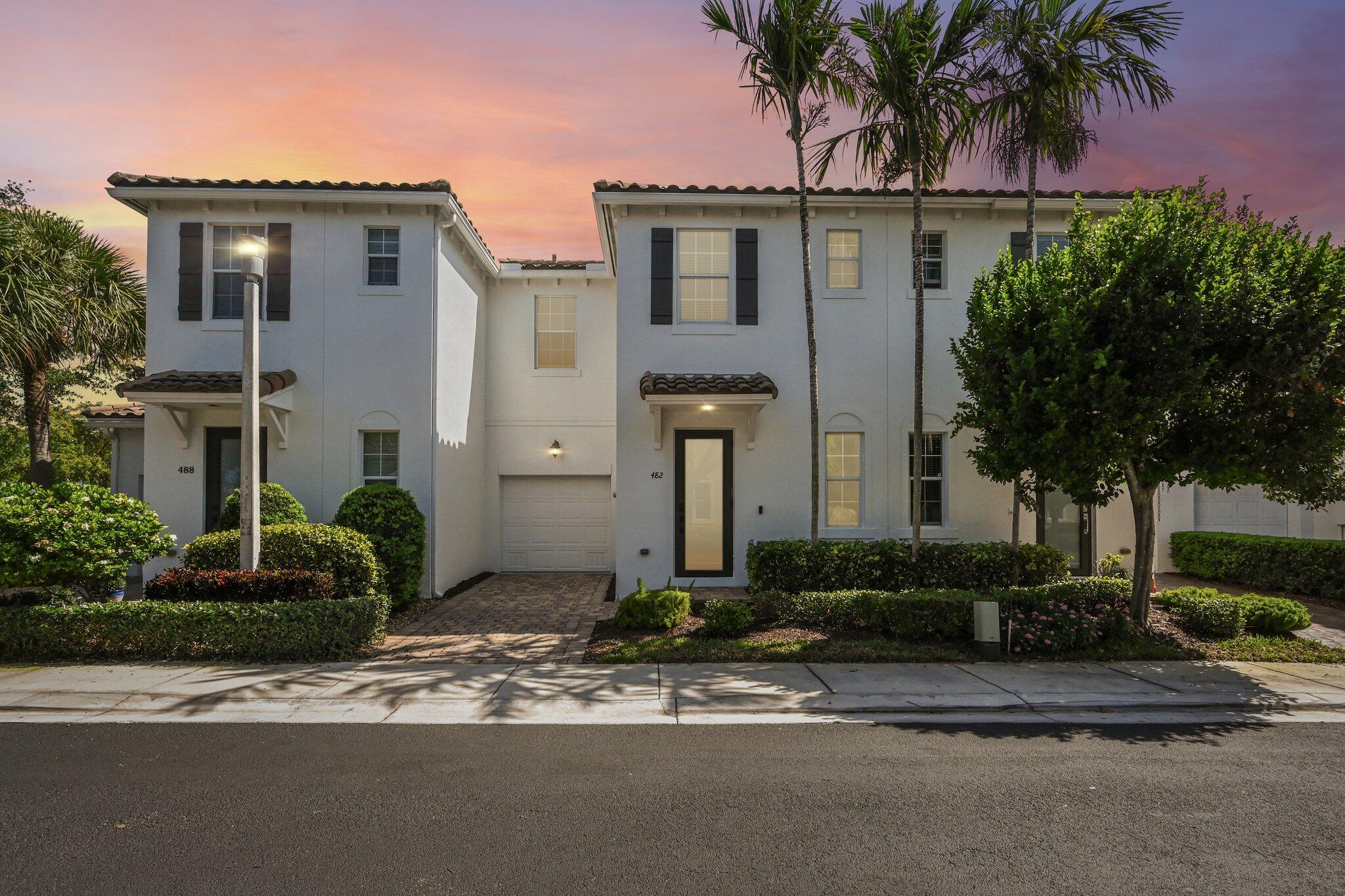 482 Graham Place Boynton Beach, FL 33435 - Photo 39 of 39 a front view of a house with garden