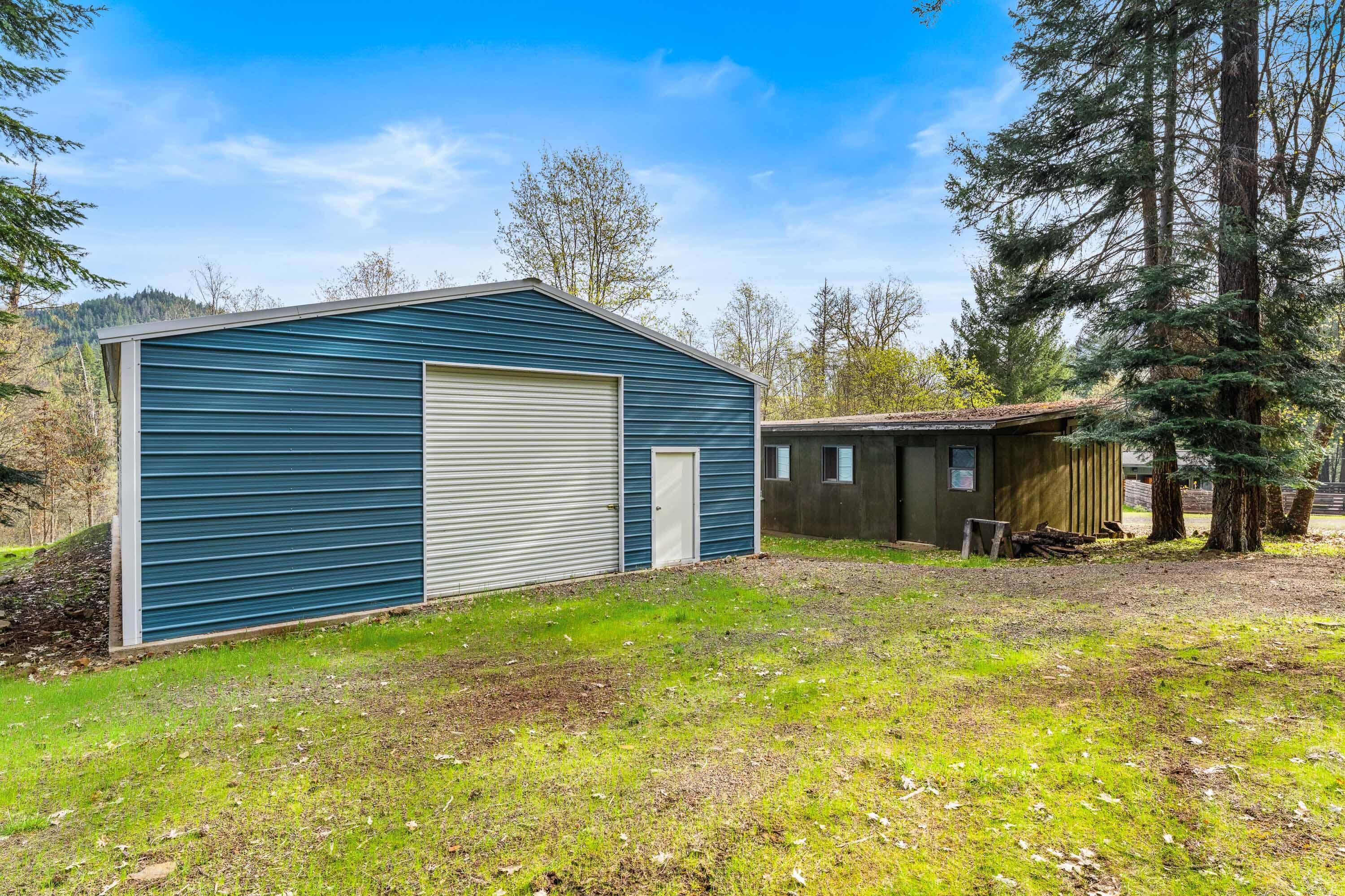 7201 Crowfoot Road Trail, OR 97541 - Photo 49 of 56 a front view of a house with a garden