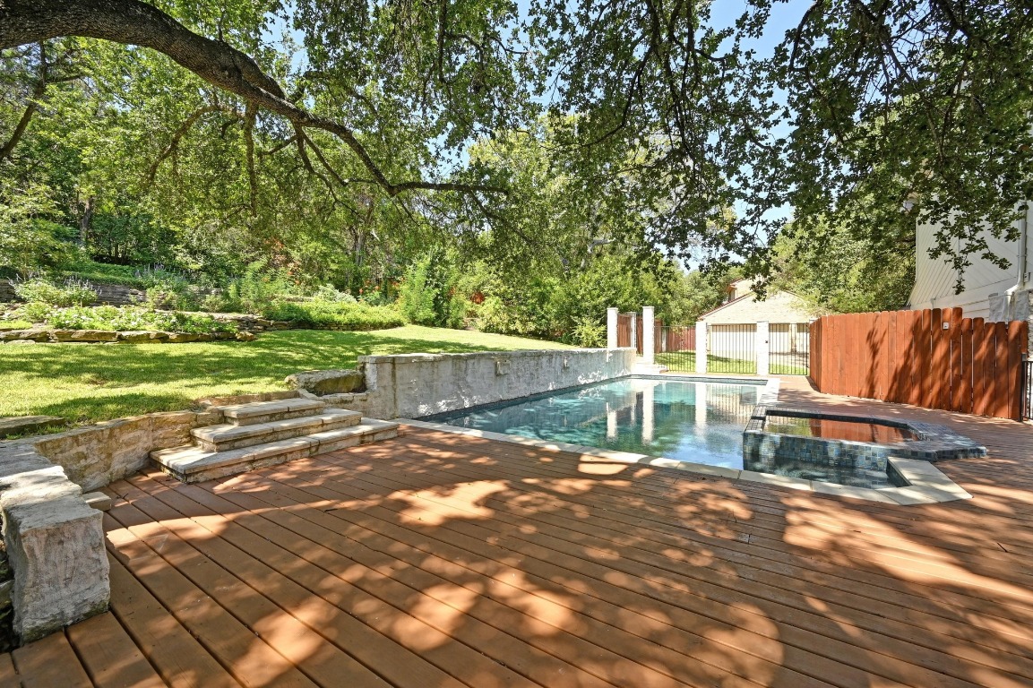4207 Bennedict Lane Austin, TX 78746 - Photo 11 of 27 a backyard of a house with table and chairs