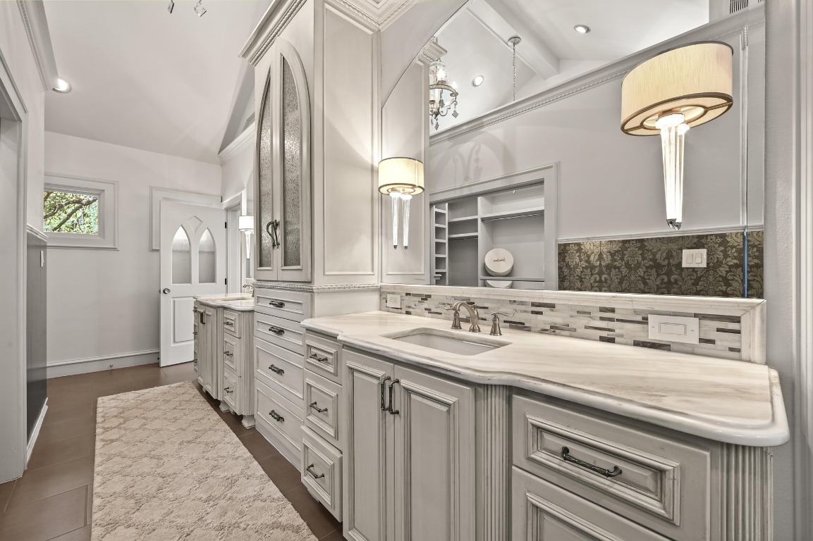 4207 Bennedict Lane Austin, TX 78746 - Photo 14 of 27 a bathroom with a double vanity sink mirror and