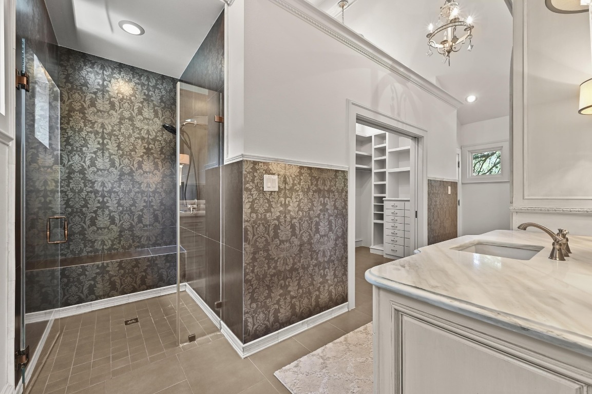 4207 Bennedict Lane Austin, TX 78746 - Photo 15 of 27 a bathroom with a shower and a sink a mirror