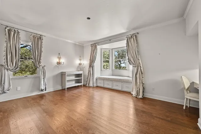 a bathroom with a granite countertop sink a toilet and a mirror