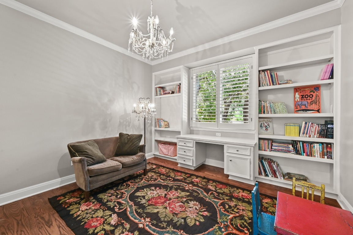 4207 Bennedict Lane Austin, TX 78746 - Photo 18 of 27 a living room with furniture and a book shelf