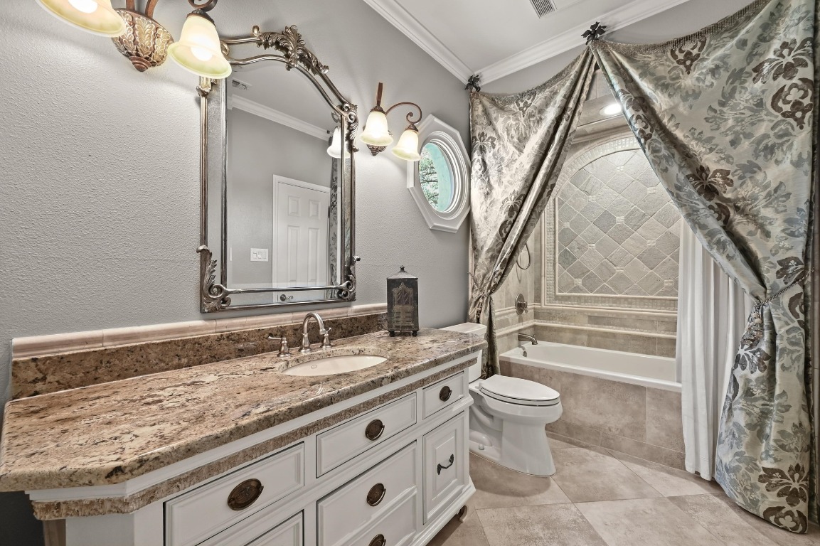 4207 Bennedict Lane Austin, TX 78746 - Photo 19 of 27 a bathroom with a granite countertop sink a toilet and a mirror