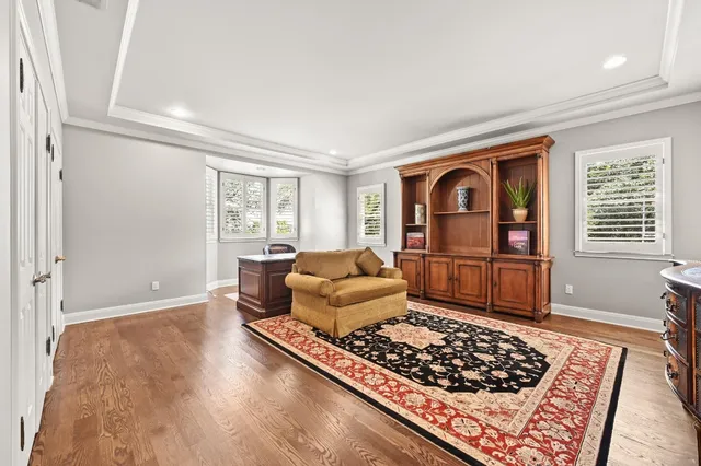 a kitchen with a stove a sink and a window