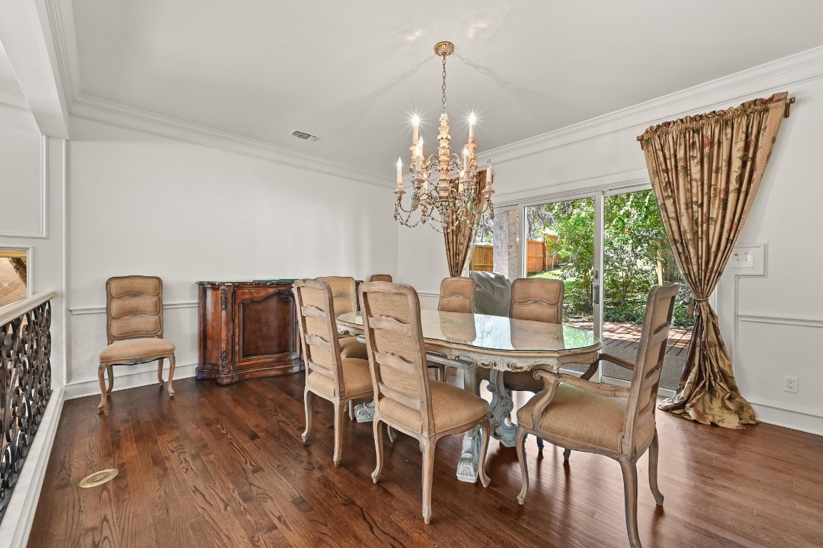 4207 Bennedict Lane Austin, TX 78746 - Photo 5 of 27 a view of a dining room with furniture window and wooden floor