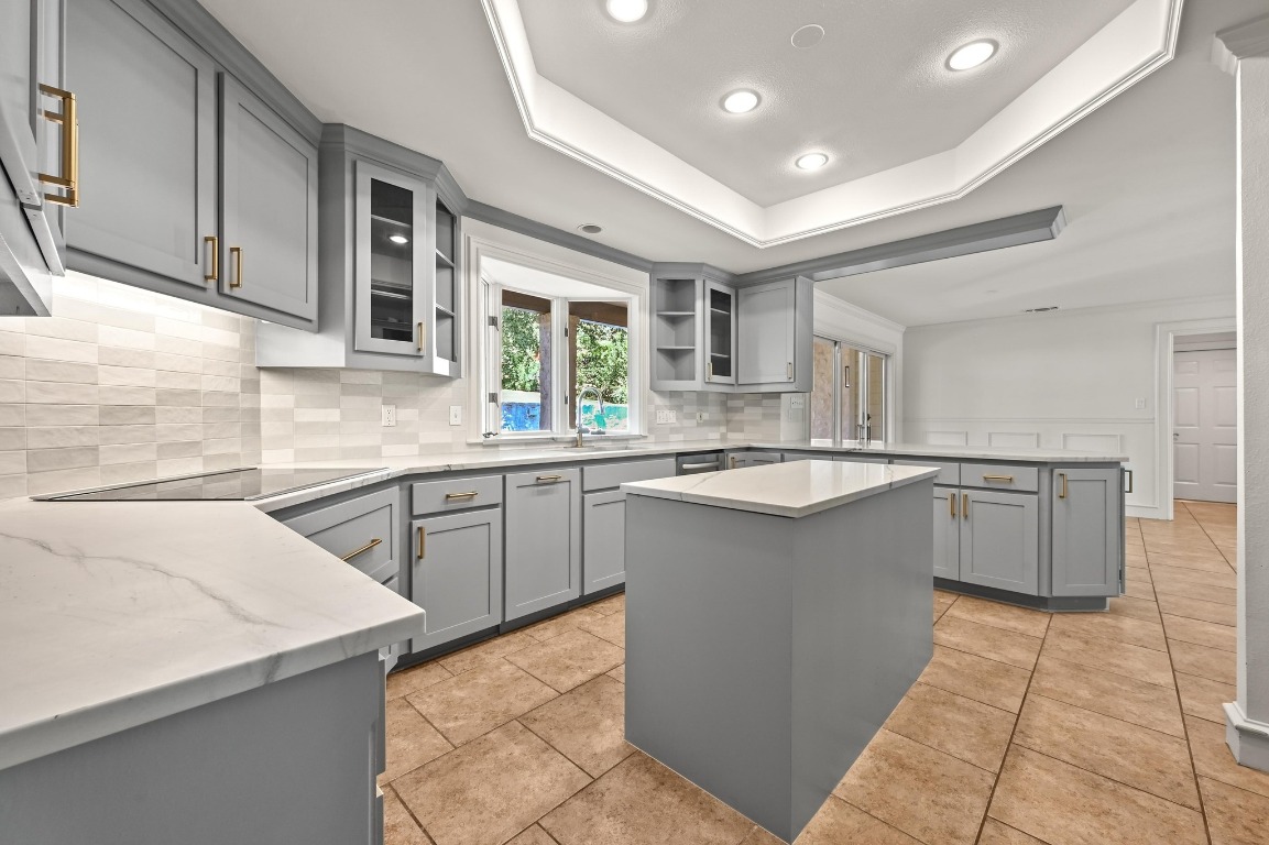 4207 Bennedict Lane Austin, TX 78746 - Photo 8 of 27 a kitchen with a sink window and cabinets