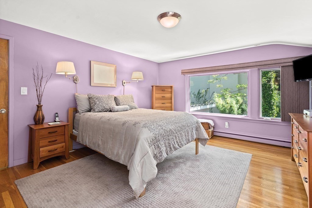 26 Valley Spring Road Newton, MA 02458 - Photo 14 of 24 a bed room with a bed and a chair