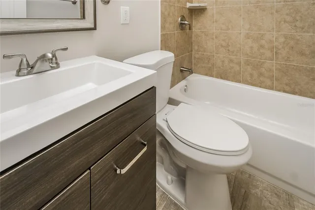 a bathroom with a sink and toilet