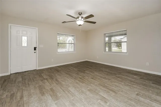 a view of an empty room with a window