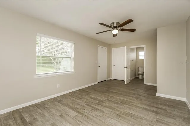 a view of an empty room with a window