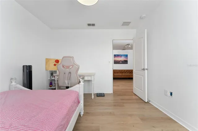 a bedroom with a bed and a cabinets