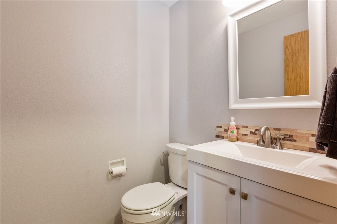 21814 4th Avenue Southeast Bothell, WA 98021 - Photo 12 of 25 a bathroom with a sink a toilet and mirror