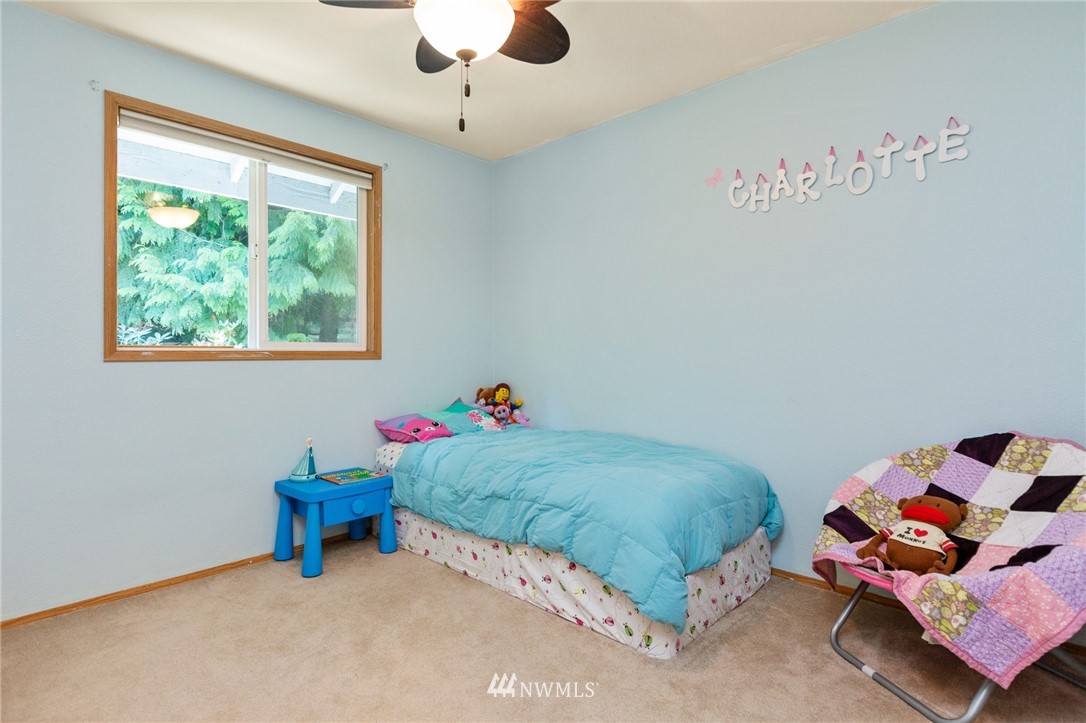 21814 4th Avenue Southeast Bothell, WA 98021 - Photo 17 of 25 a bedroom with a bed and a window