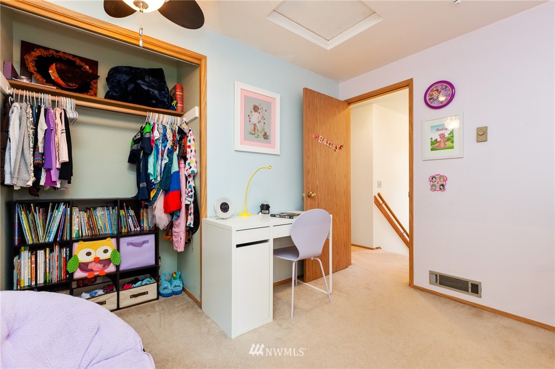 21814 4th Avenue Southeast Bothell, WA 98021 - Photo 20 of 25 a view of walk in closet with clothes and shoes