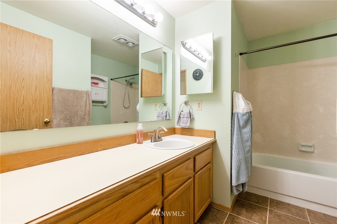 21814 4th Avenue Southeast Bothell, WA 98021 - Photo 21 of 25 a bathroom with a sink and a mirror