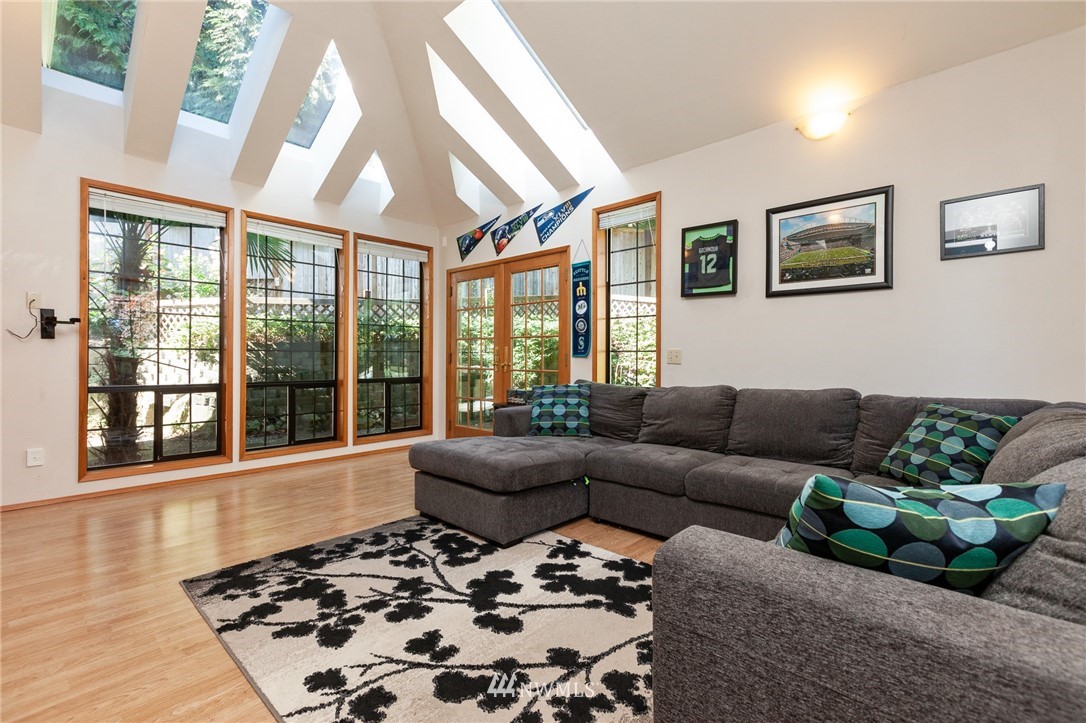 21814 4th Avenue Southeast Bothell, WA 98021 - Photo 4 of 25 a living room with furniture and a large window