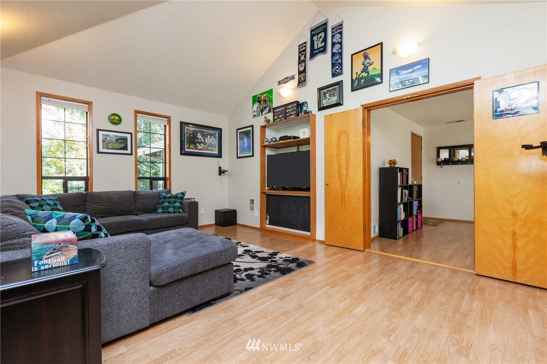 21814 4th Avenue Southeast Bothell, WA 98021 - Photo 5 of 25 a living room with furniture and a flat screen tv