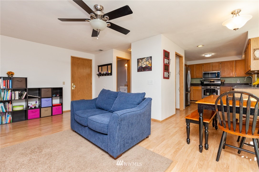 21814 4th Avenue Southeast Bothell, WA 98021 - Photo 7 of 25 a living room with furniture and kitchen view