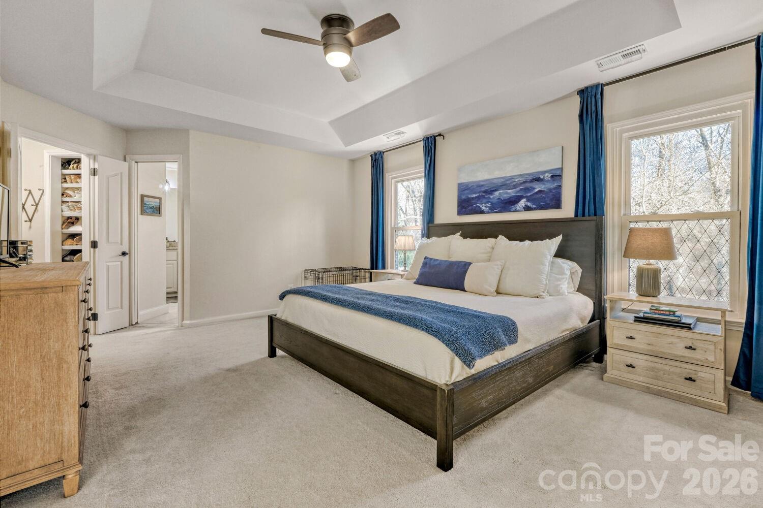 8607 Forest Shadow Circle Cornelius, NC 28031 - Photo 16 of 45 a spacious bedroom with a bed and a window