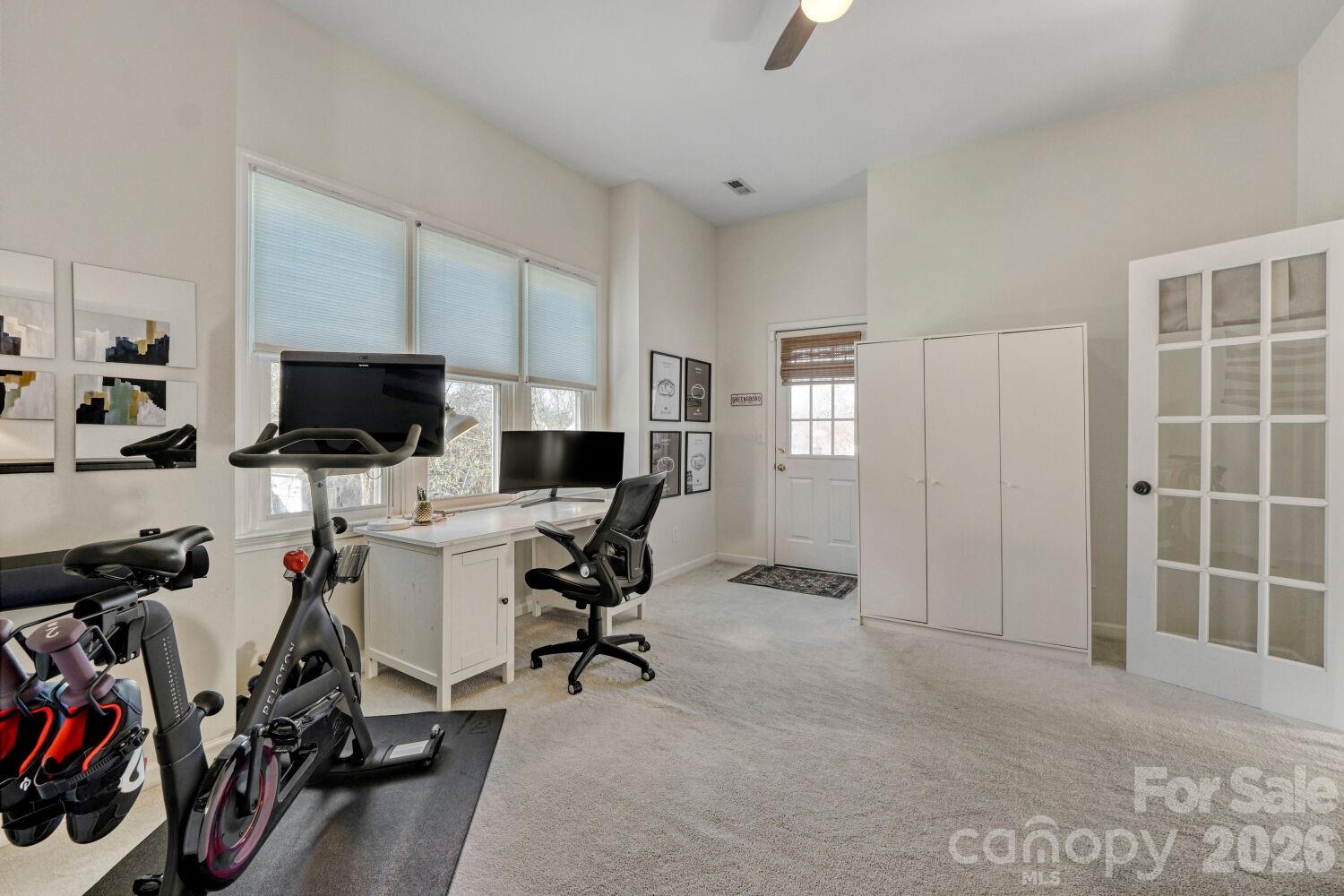 8607 Forest Shadow Circle Cornelius, NC 28031 - Photo 22 of 45 a view of a workspace with furniture and a window