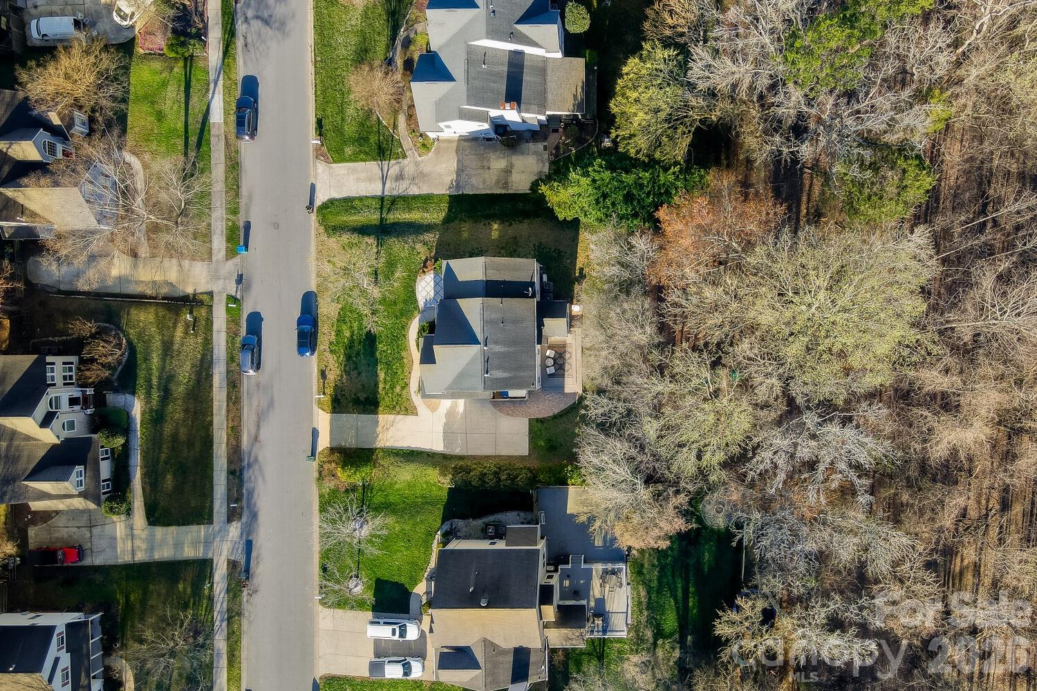 8607 Forest Shadow Circle Cornelius, NC 28031 - Photo 34 of 45 an aerial view of multiple houses with yard