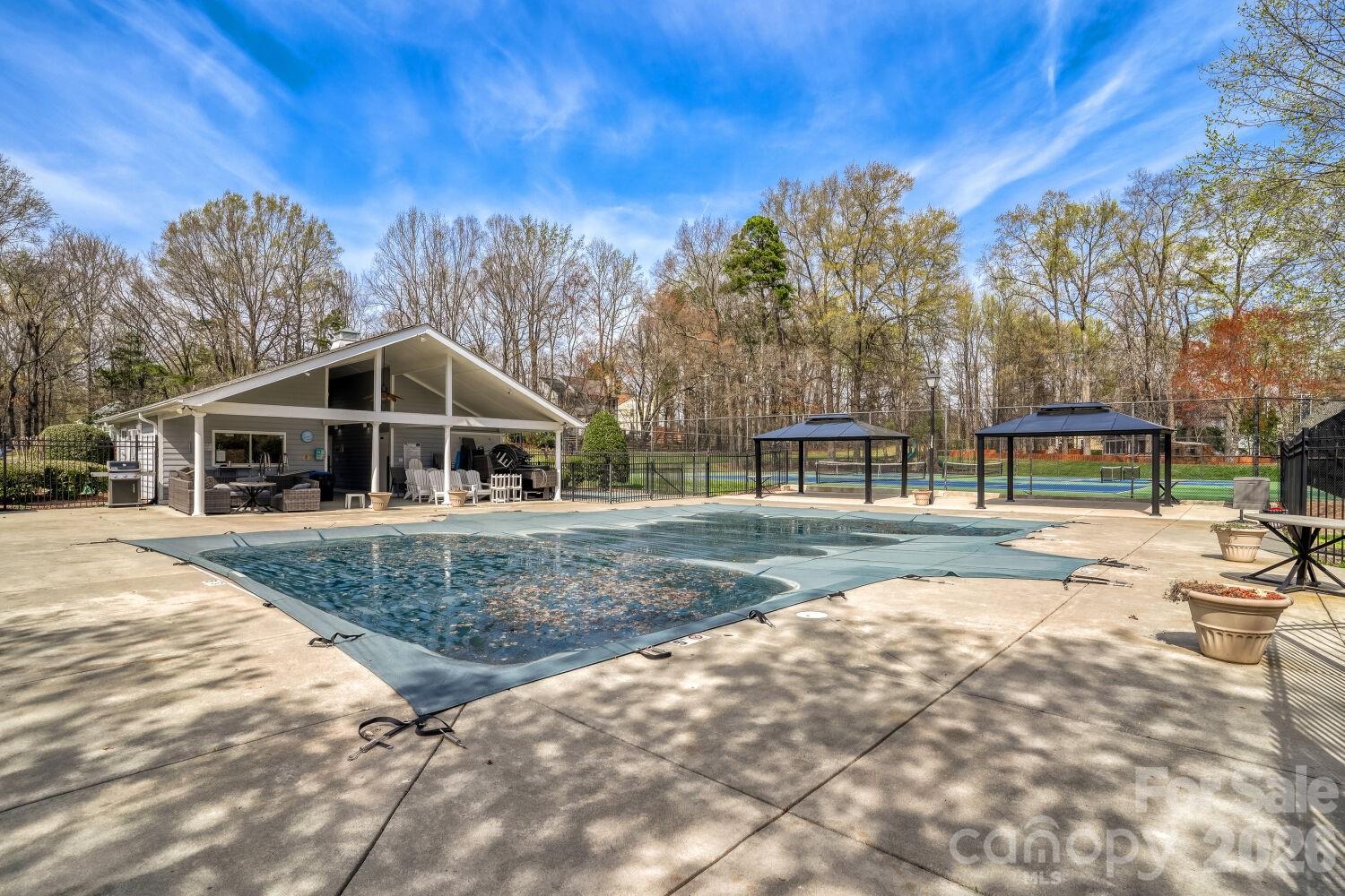 8607 Forest Shadow Circle Cornelius, NC 28031 - Photo 40 of 45 a view of house with outdoor space and swimming pool