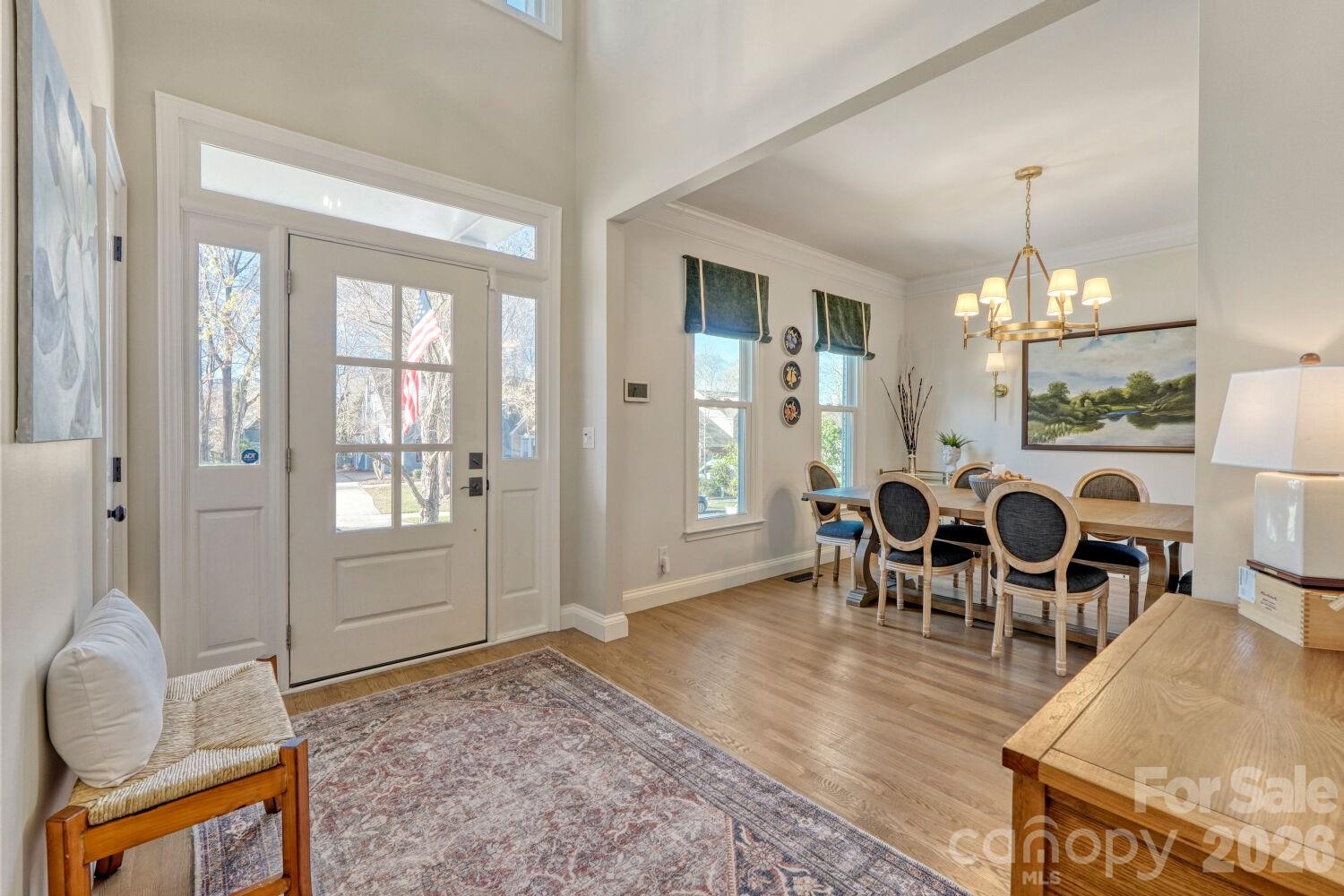 8607 Forest Shadow Circle Cornelius, NC 28031 - Photo 5 of 45 a view of a dining room with furniture and chandelier