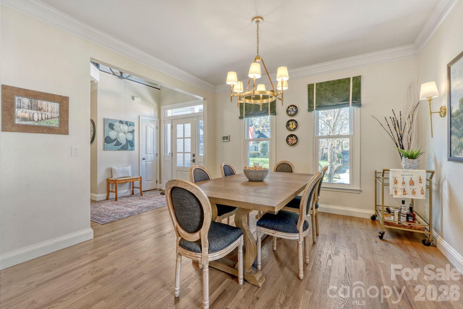 8607 Forest Shadow Circle Cornelius, NC 28031 - Photo 6 of 45 a view of a dining room with furniture window and wooden floor