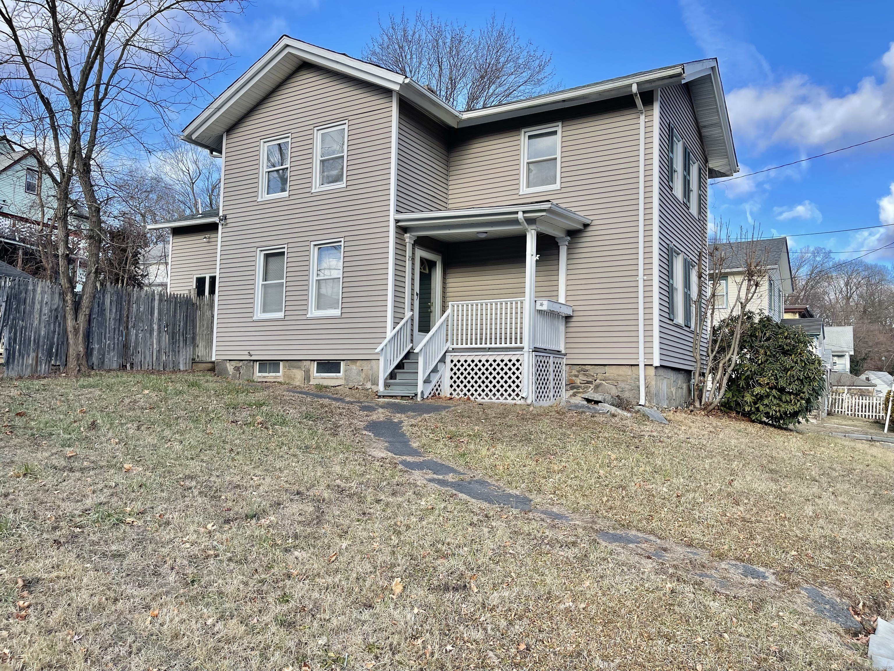 25 Pleasant Street Ansonia, CT 06401 - Photo 1 of 25 a front view of a house with a yard and garage