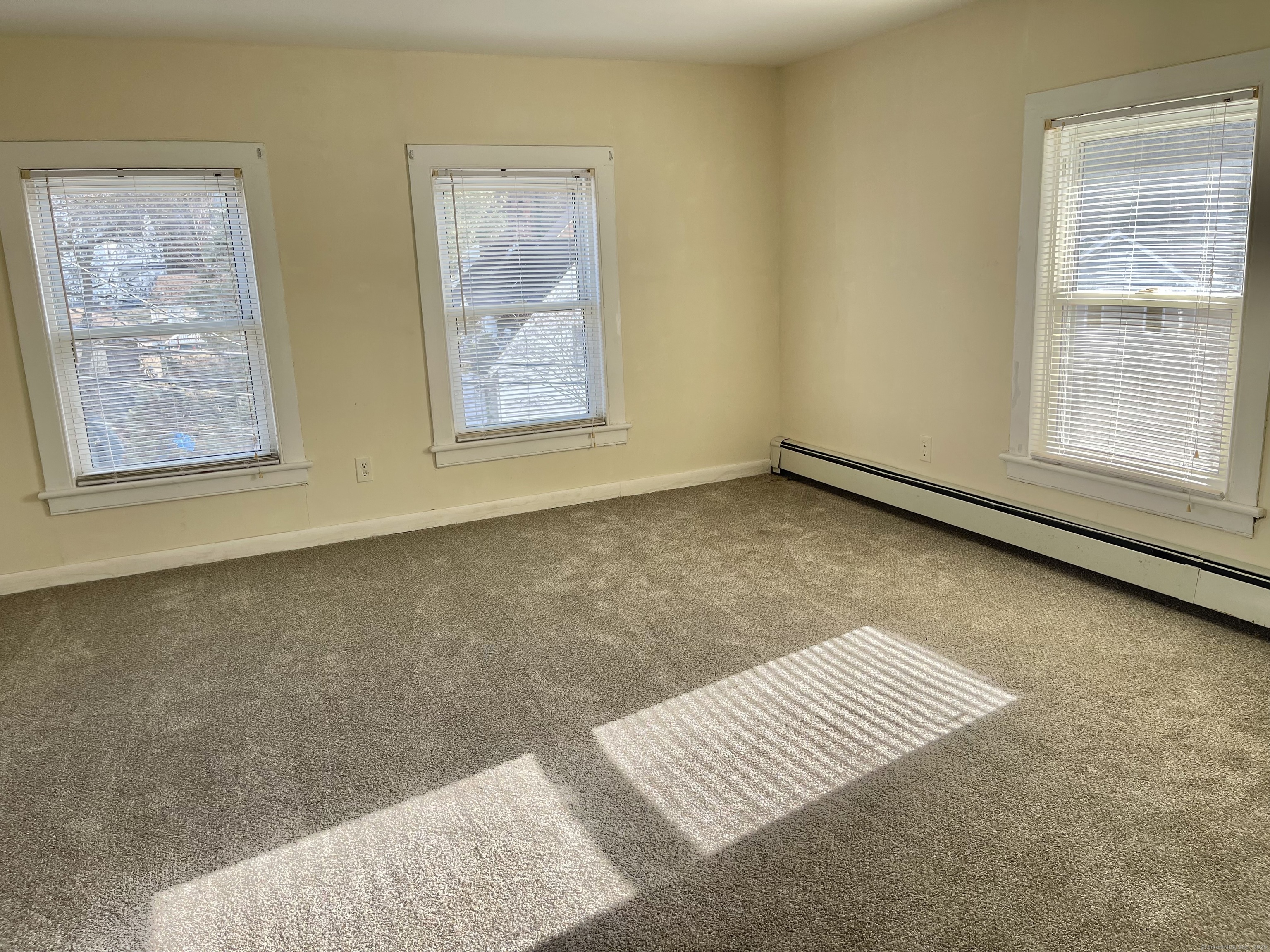 25 Pleasant Street Ansonia, CT 06401 - Photo 13 of 25 a view of an empty room and window