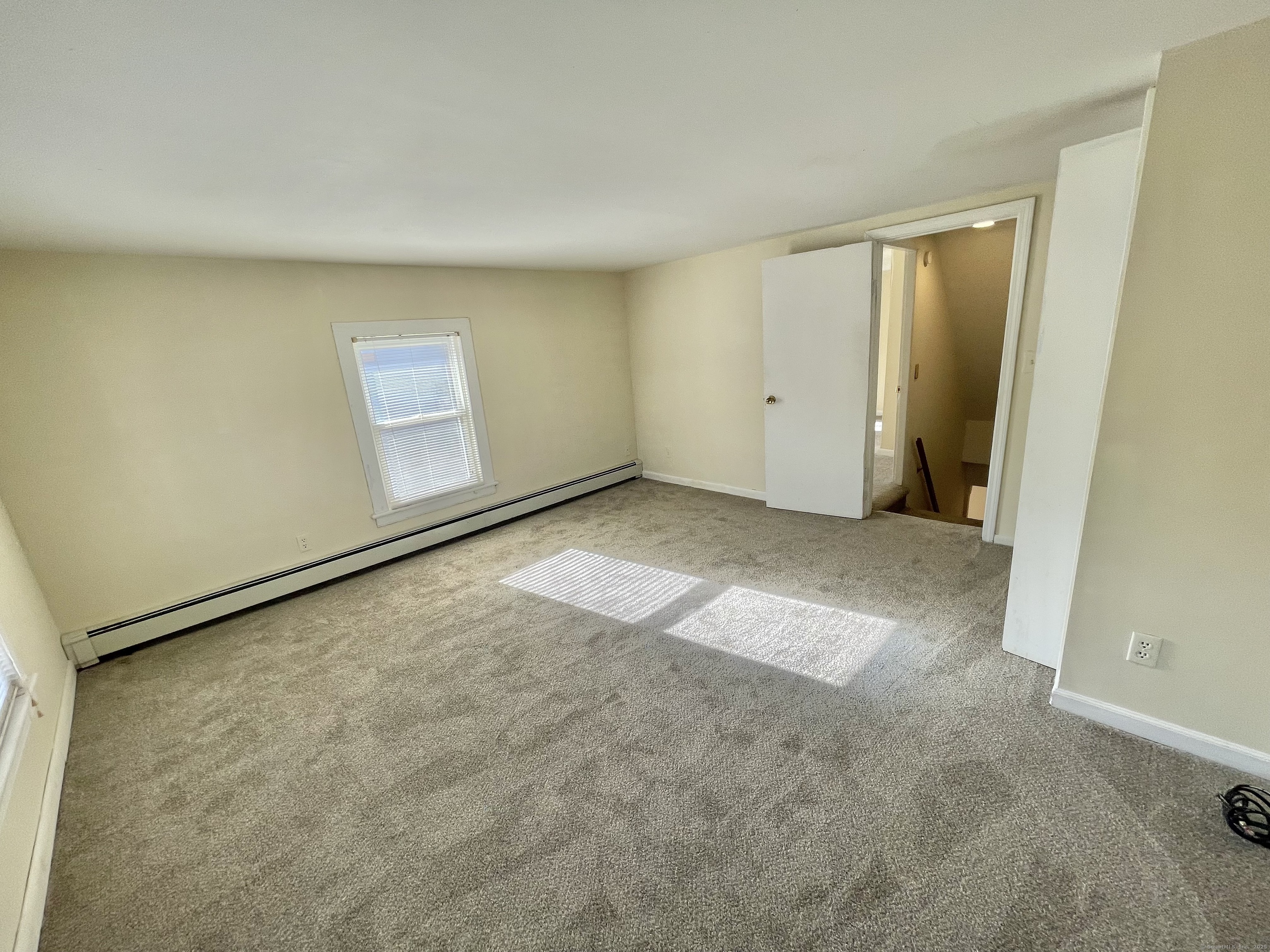25 Pleasant Street Ansonia, CT 06401 - Photo 15 of 25 an empty room with a natural light