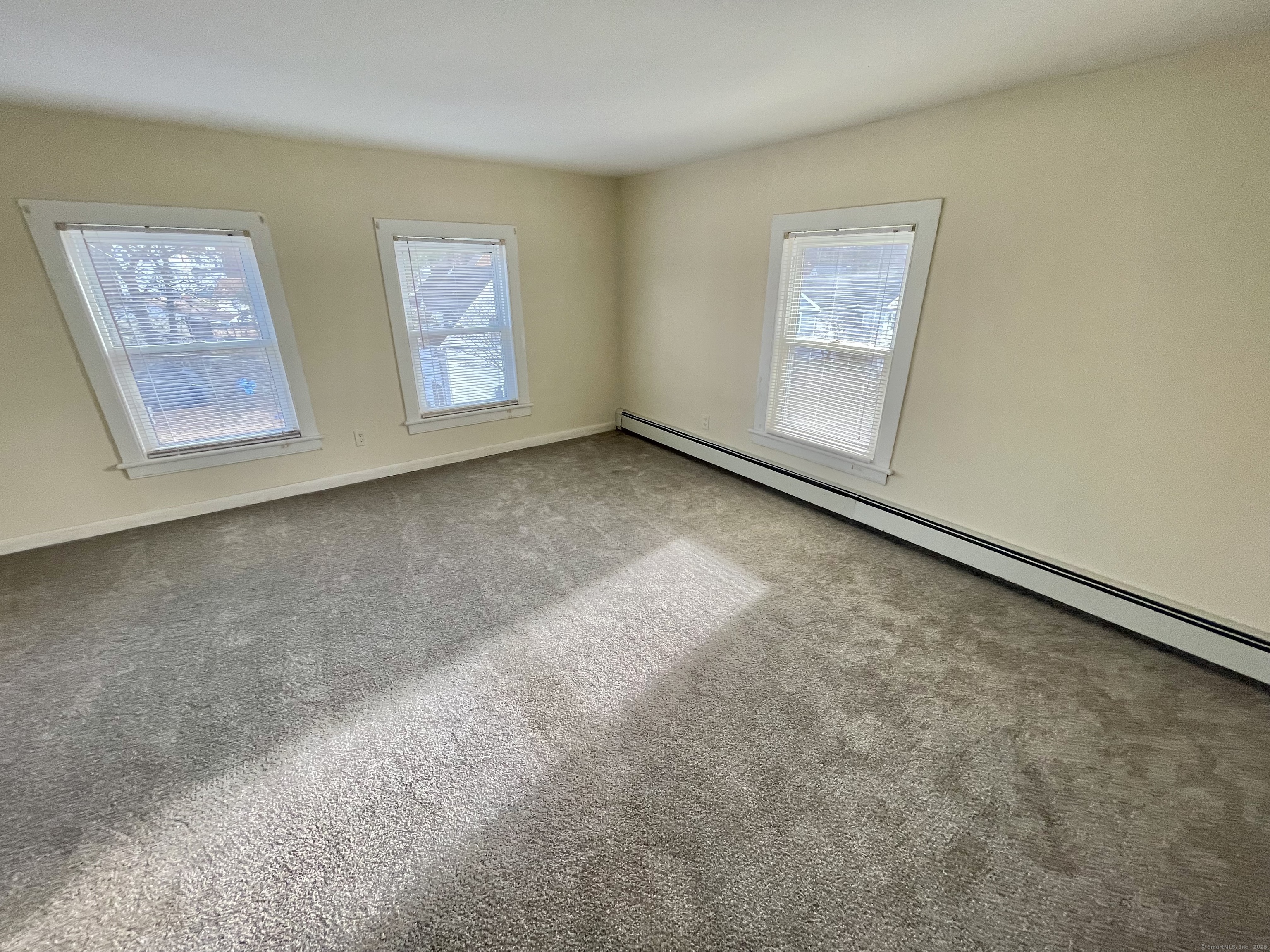 25 Pleasant Street Ansonia, CT 06401 - Photo 16 of 25 a view of an empty room with windows