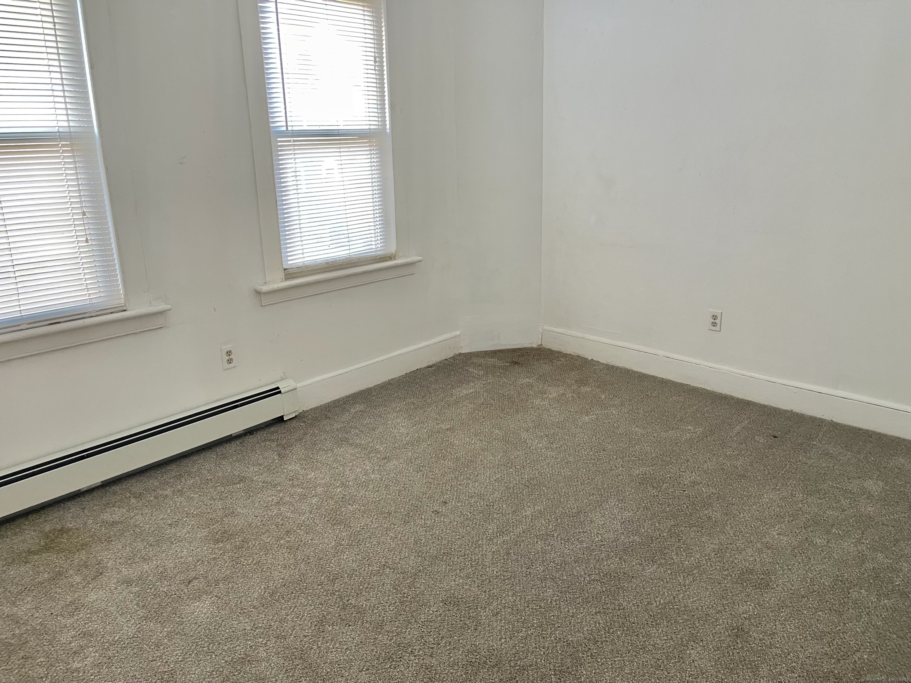 25 Pleasant Street Ansonia, CT 06401 - Photo 18 of 25 an empty room with a window
