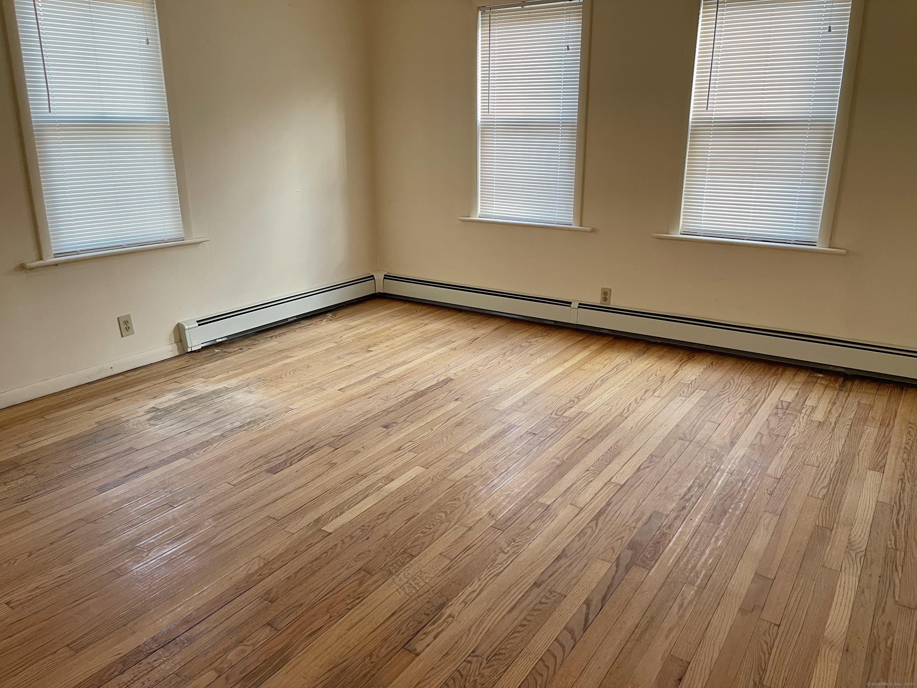 25 Pleasant Street Ansonia, CT 06401 - Photo 20 of 25 a view of a room with wooden floor and window