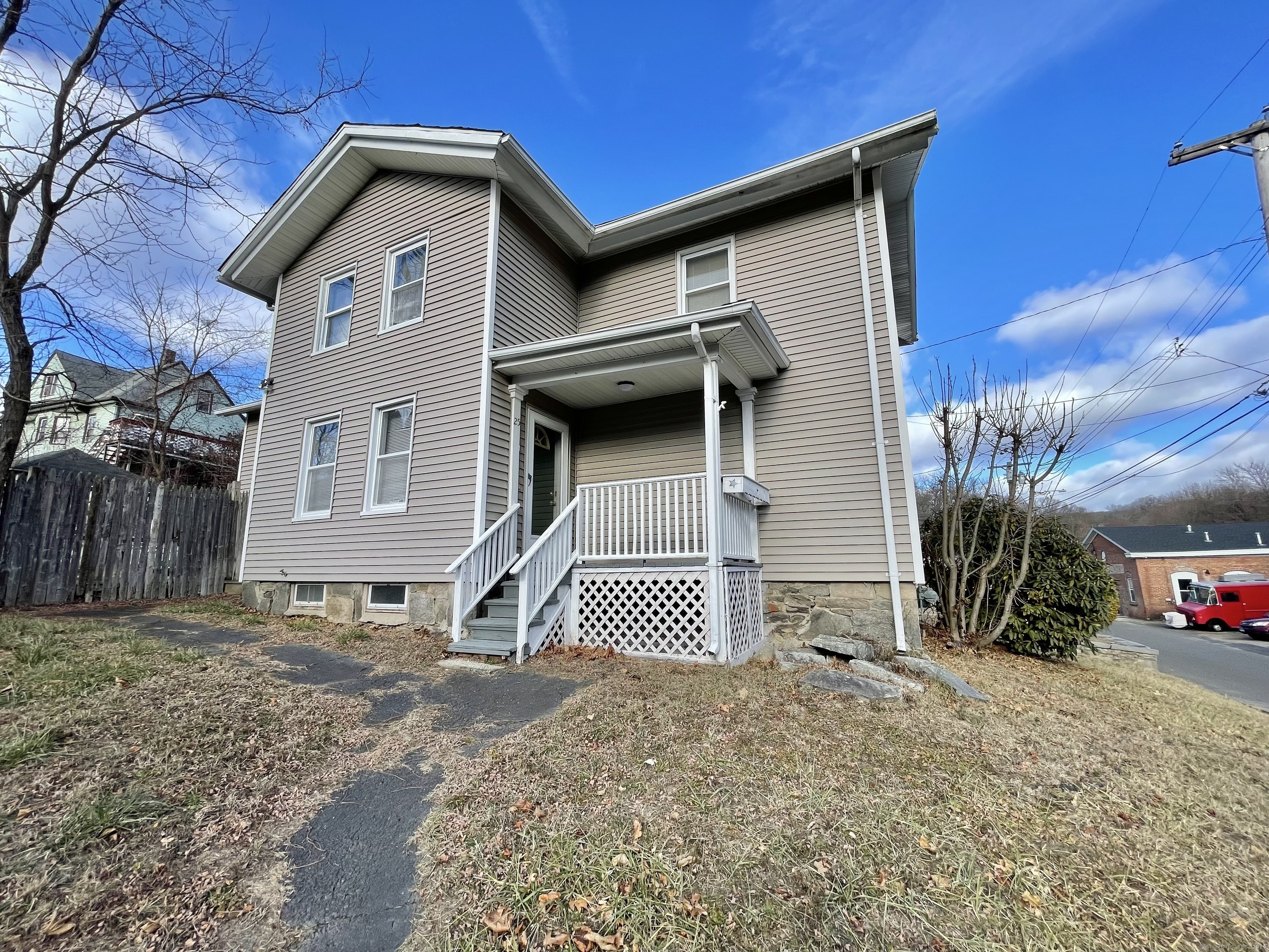 25 Pleasant Street Ansonia, CT 06401 - Photo 2 of 25 a front view of a house with a yard