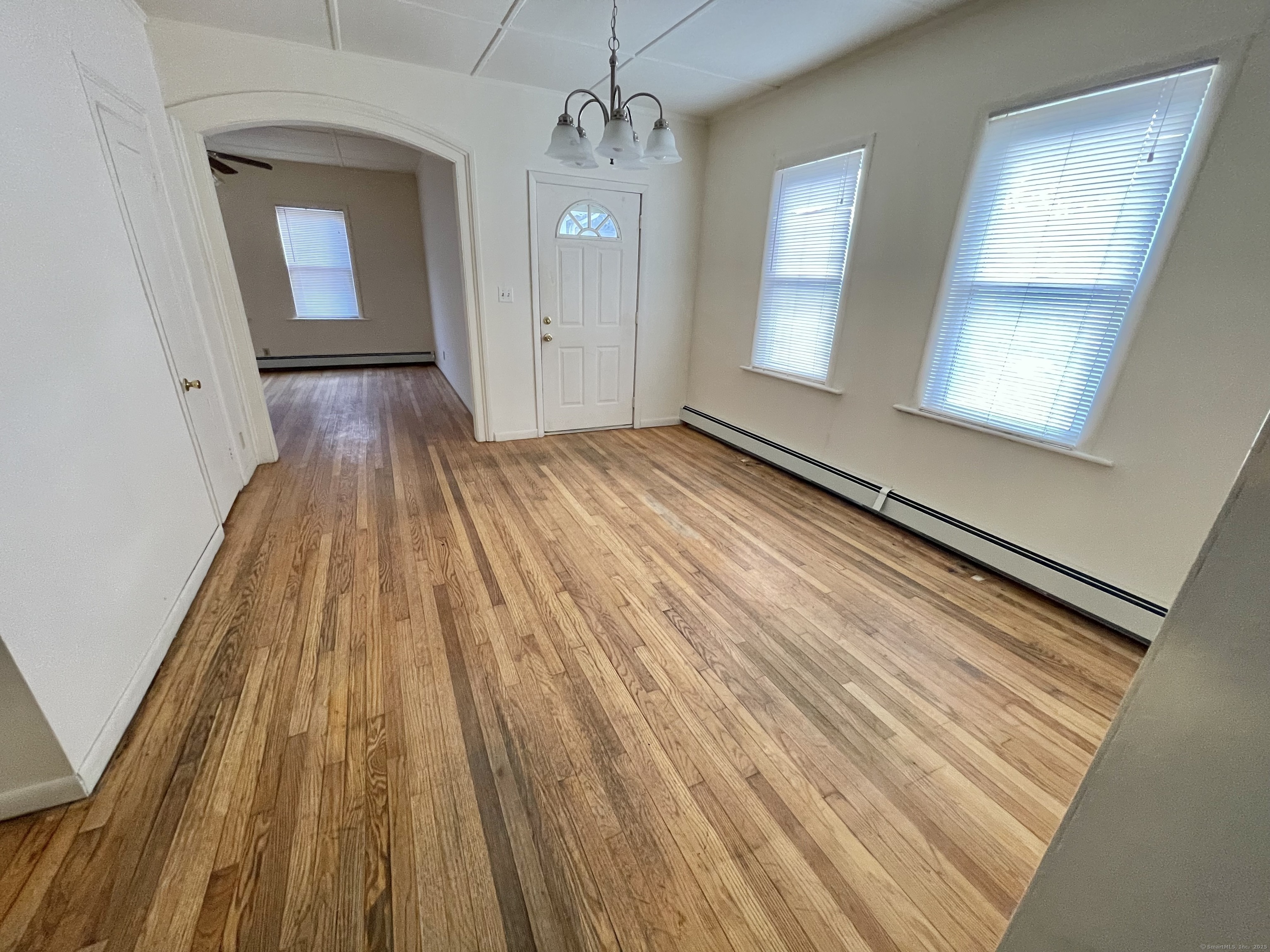 25 Pleasant Street Ansonia, CT 06401 - Photo 23 of 25 a view of a room with wooden floor and staircase