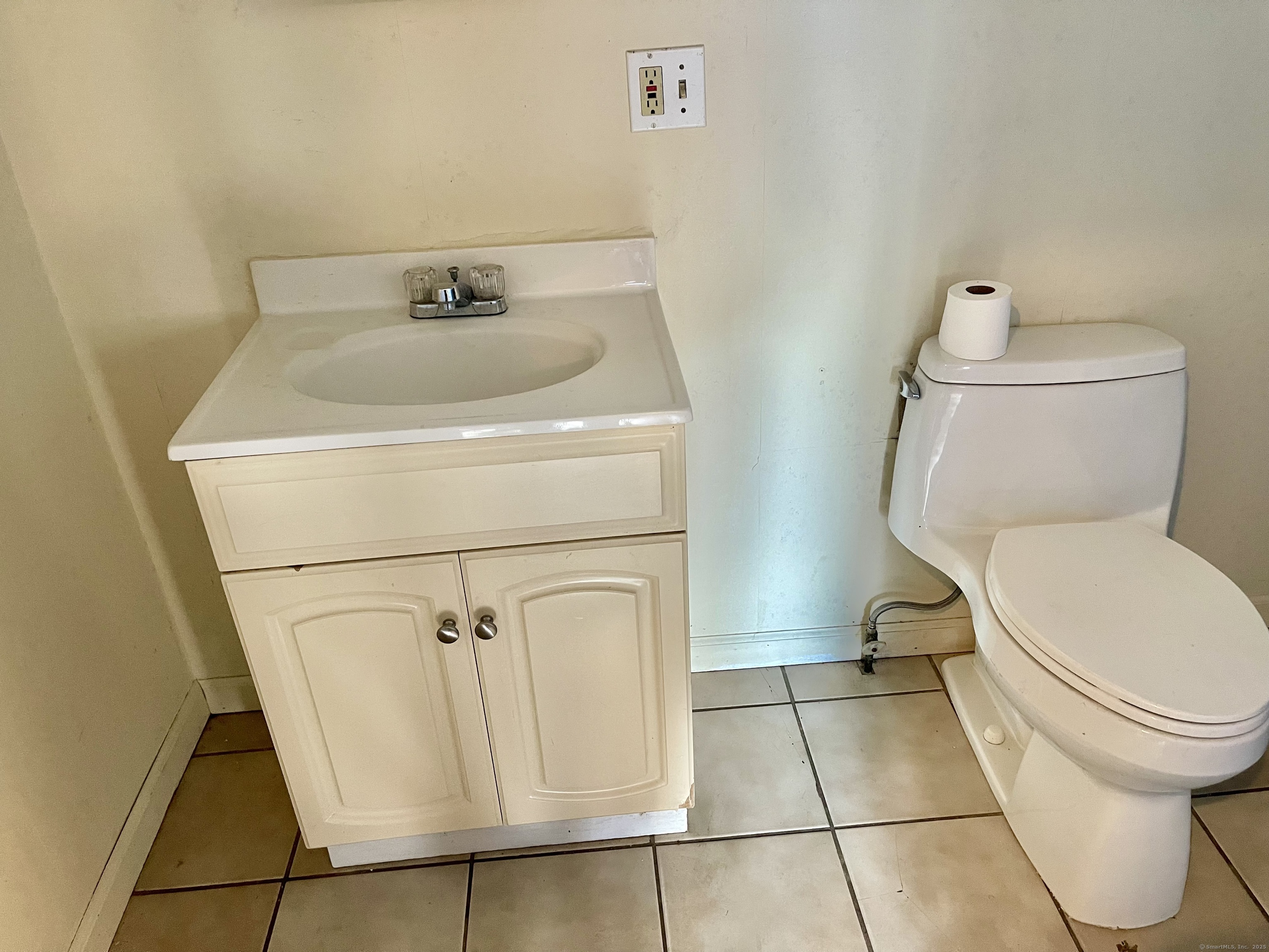 25 Pleasant Street Ansonia, CT 06401 - Photo 24 of 25 a bathroom with a toilet and a sink