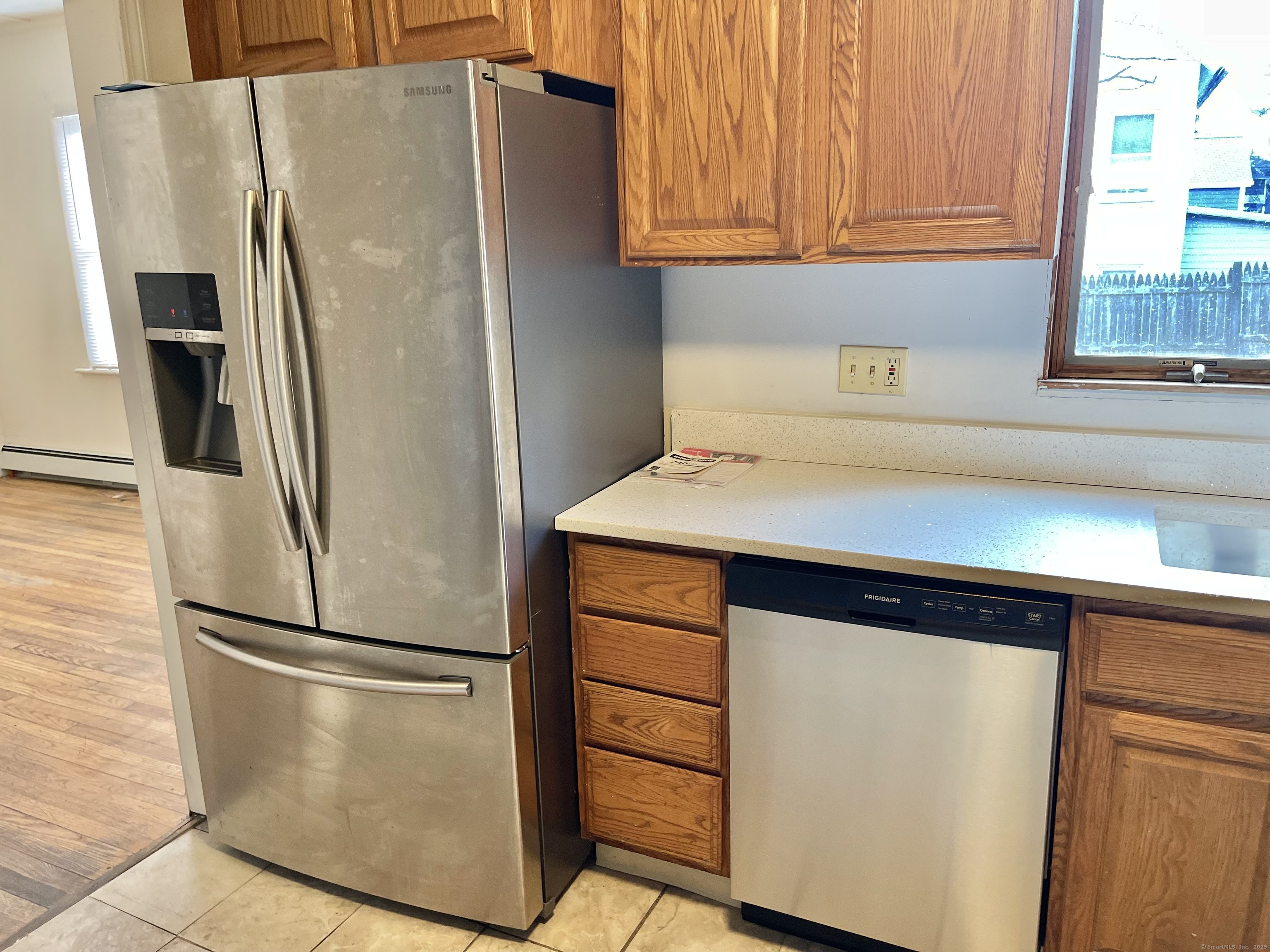 25 Pleasant Street Ansonia, CT 06401 - Photo 3 of 25 a close view of a refrigerator in kitchen