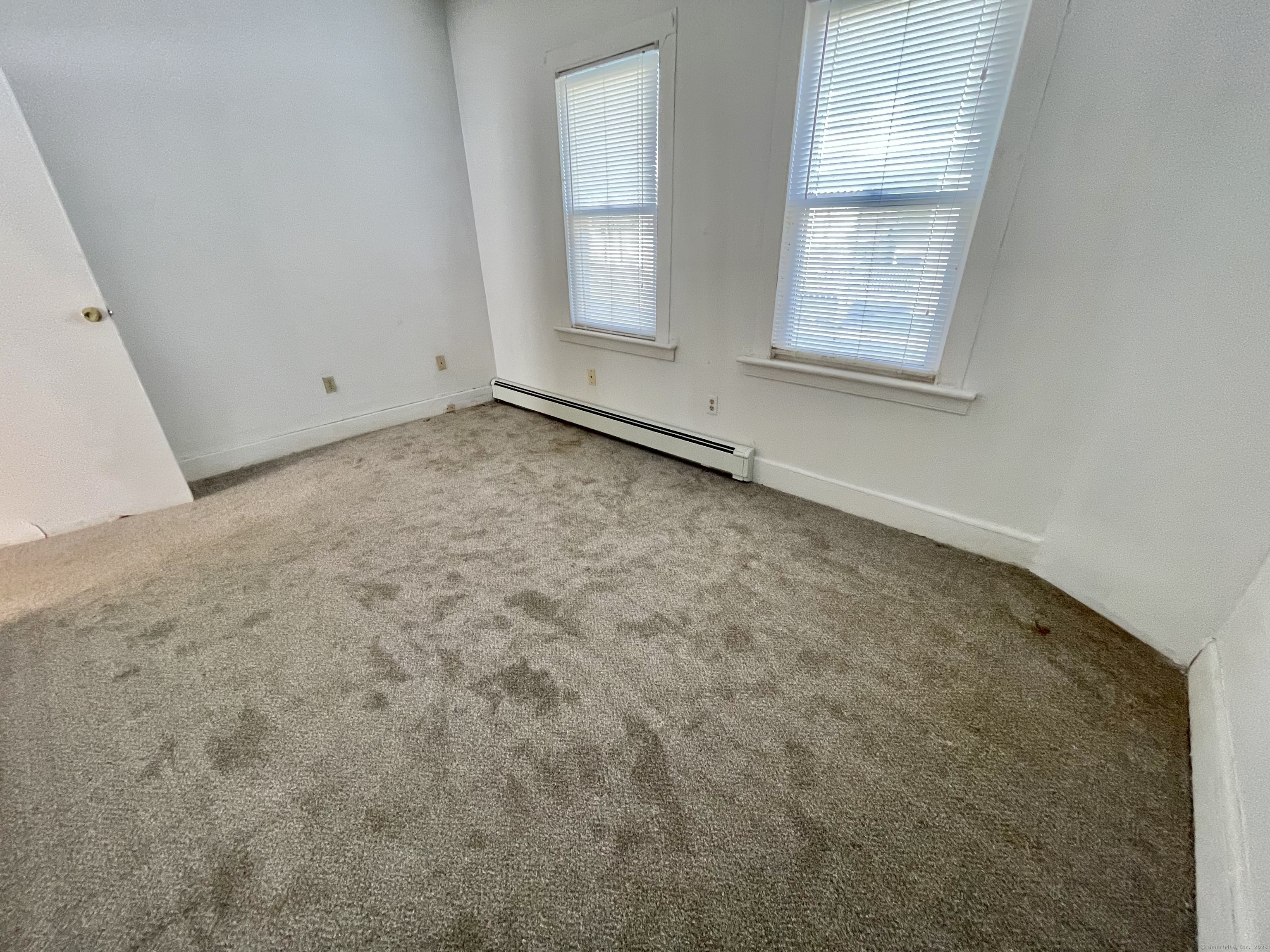 25 Pleasant Street Ansonia, CT 06401 - Photo 6 of 25 an empty room with windows