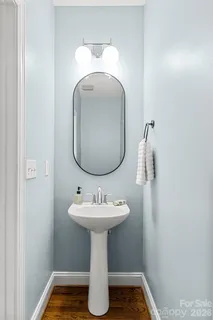 a bathroom with a sink toilet