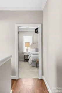 a bedroom with a bed and a mirror