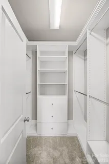a view of an empty walk in closet