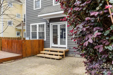 a view of a bench in front of house
