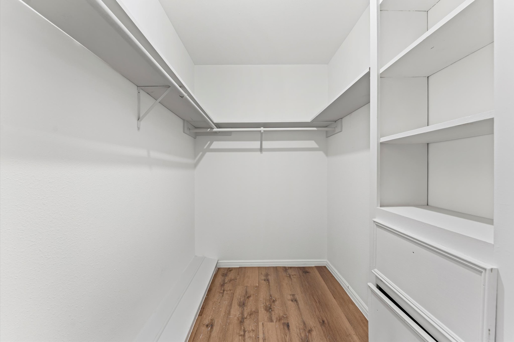 1123 Suwanee Lane Houston, TX 77090 - Photo 19 of 39 a view of an empty walk in closet