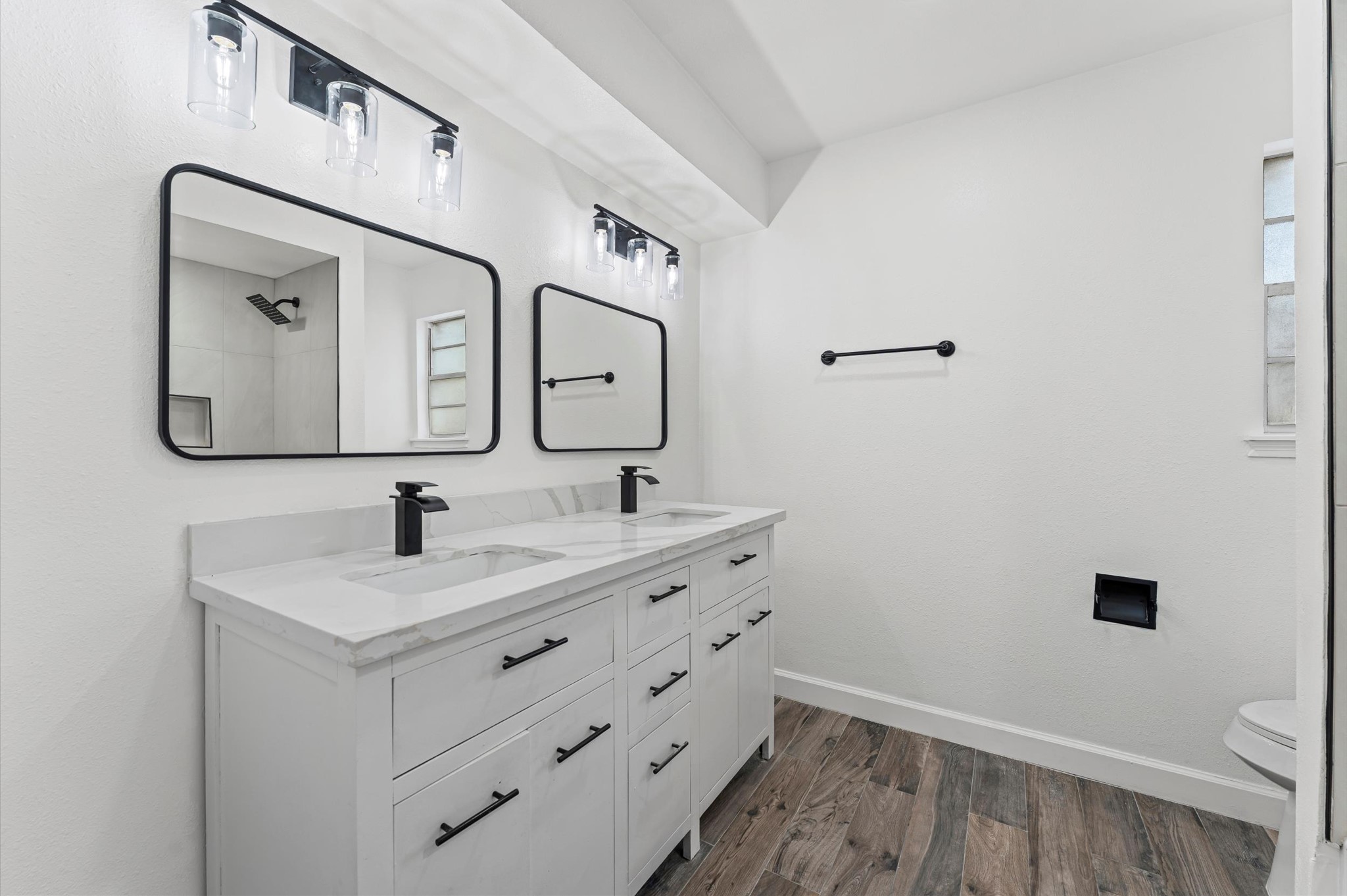 1123 Suwanee Lane Houston, TX 77090 - Photo 20 of 39 a bathroom with a sink and a mirror