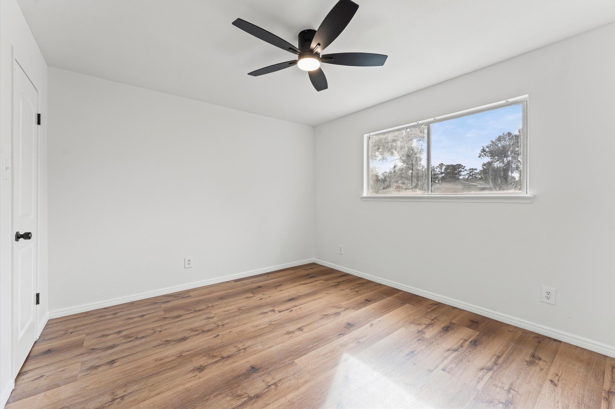 1123 Suwanee Lane Houston, TX 77090 - Photo 26 of 39 a view of empty room with wooden floor