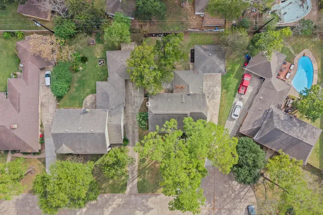 an aerial view of a house with outdoor space